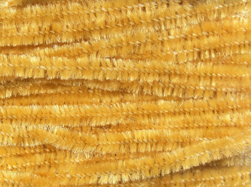 Golden yellow Hareline chenille close-up showing soft, fuzzy synthetic fibers with subtle metallic sheen for fly tying