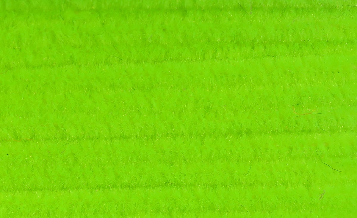 Fluorescent chartreuse Hareline chenille strip with dense fuzzy pile for fly tying