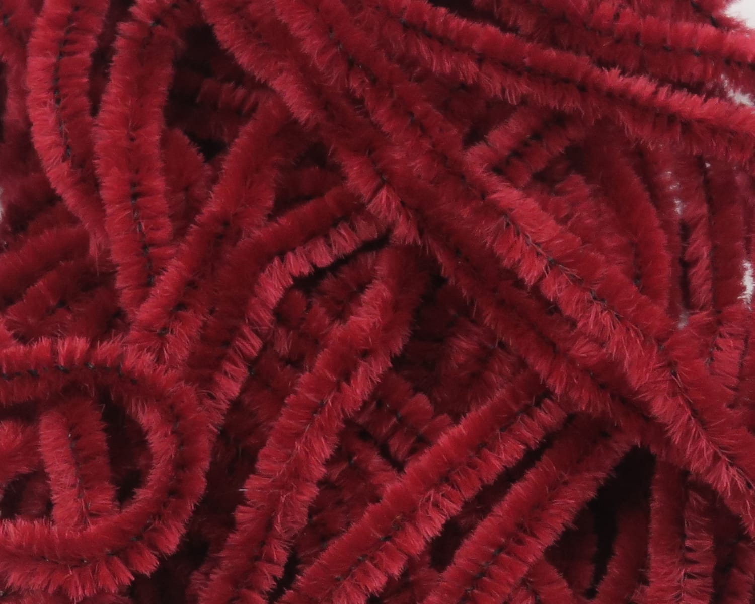 Deep red Hareline chenille strands with dense fuzzy fibers and visible dark core, plush material for fly tying
