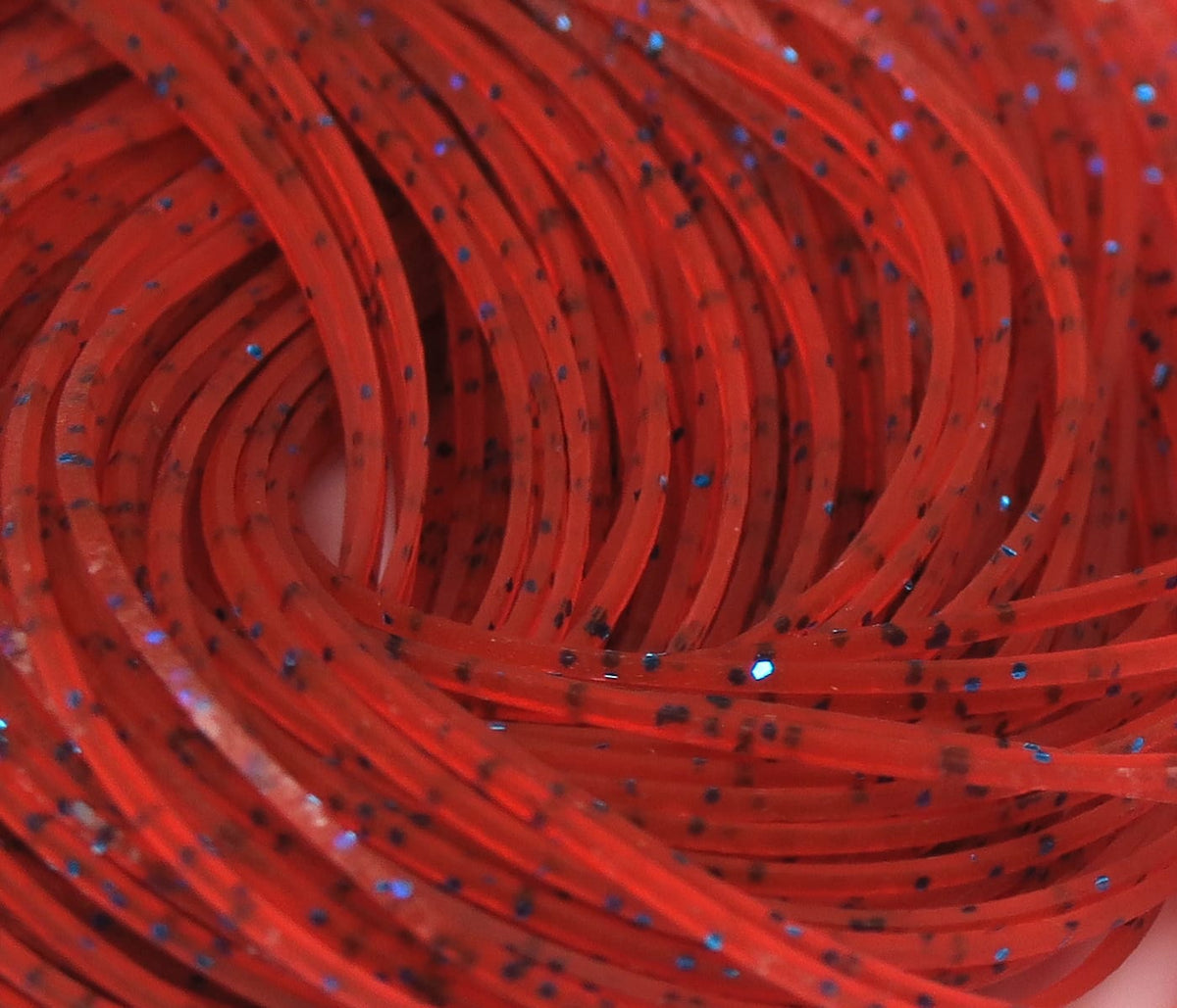 Red Hareline Crazy Legs fly tying rubber strands, translucent coiled legs with black specks and blue glitter