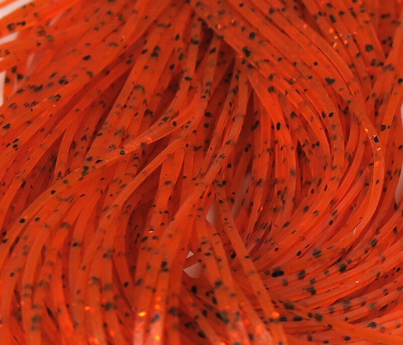 Bright orange Hareline Crazy Legs silicone strands with black speckles, glossy flexible legs for fly tying lures.