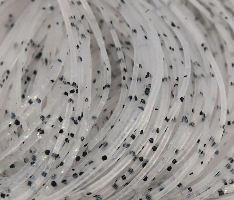 Translucent white Hareline Crazy Legs synthetic rubber legs with black speckles and subtle iridescent glitter for fly tying.
