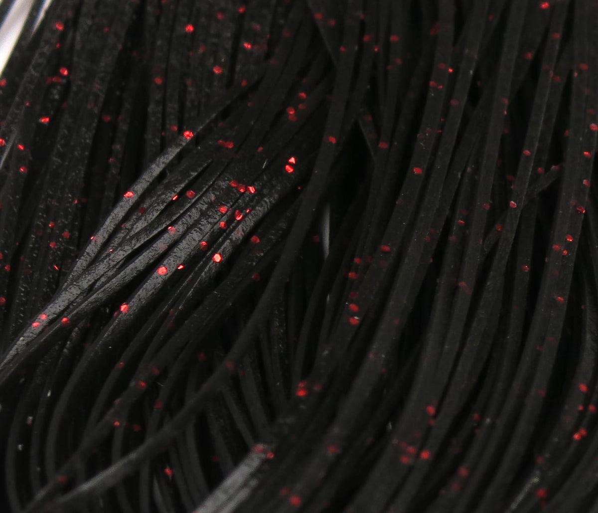 Black rubber Crazy Legs with red glitter flecks, flat synthetic strands for fly tying