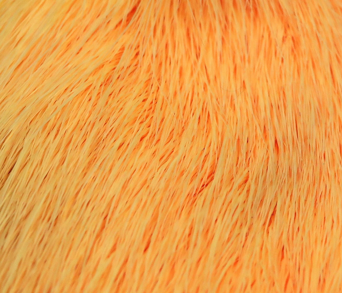Bright orange dyed deer belly hair with fine soft strands for fly tying, close-up