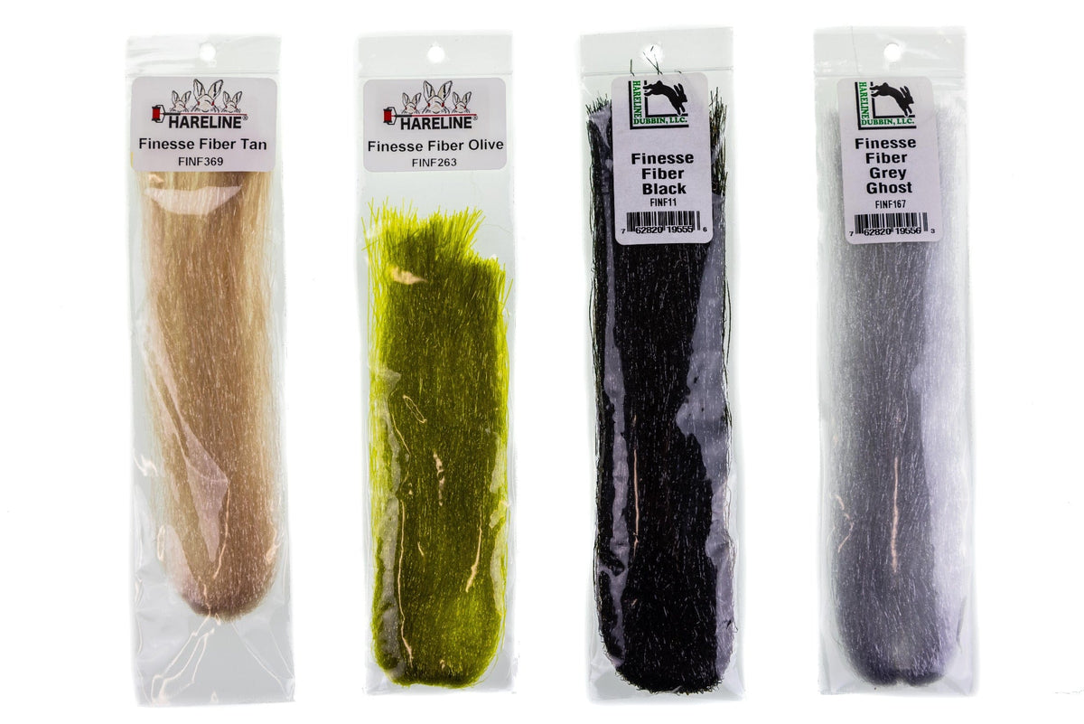 Four Hareline Finesse Fibers for fly tying: tan, olive, black and grey synthetic hairlike fibers in clear plastic