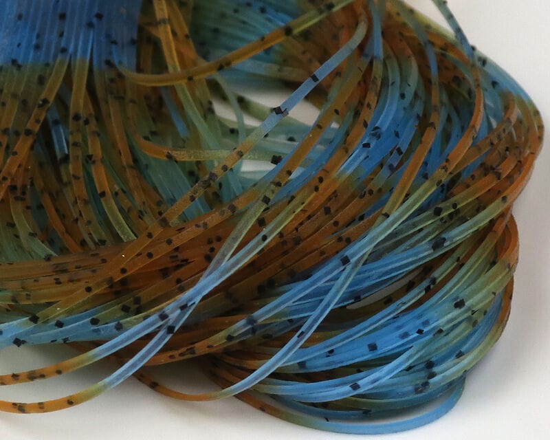Blue and olive-brown speckled rubber fly-tying legs, thin flexible strands bundled for Hareline Fly Enhancer