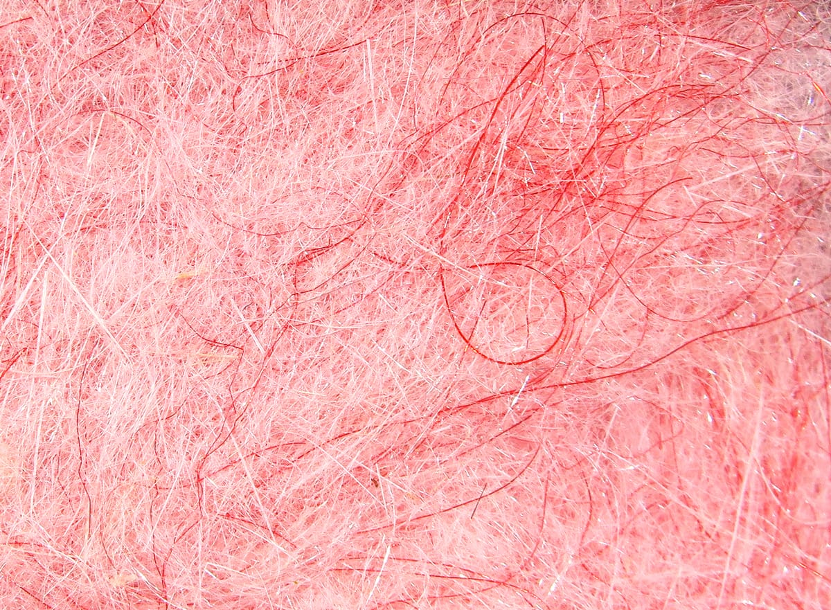 Pink Hare-Tron dubbing fibers with fine rabbit and synthetic hairs and subtle iridescent flash for fly tying