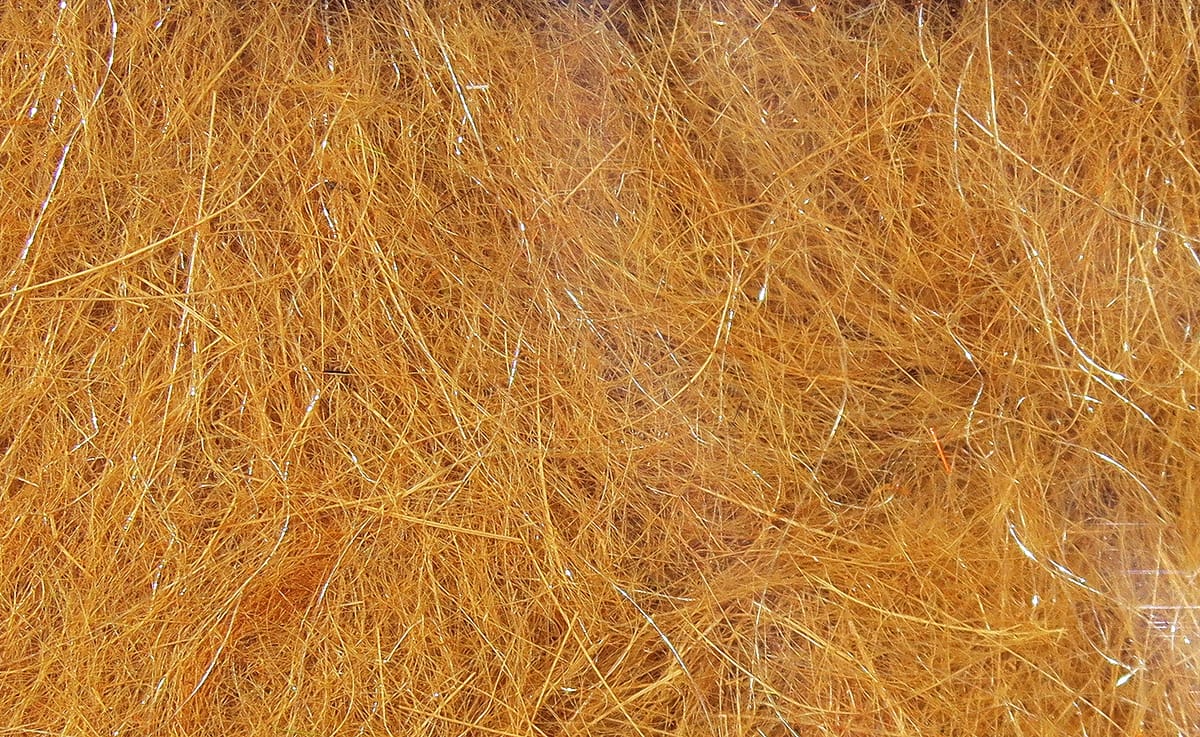 Copper-orange Hare-Tron dubbing fiber with fine fuzzy hair and subtle silver flash strands for fly tying