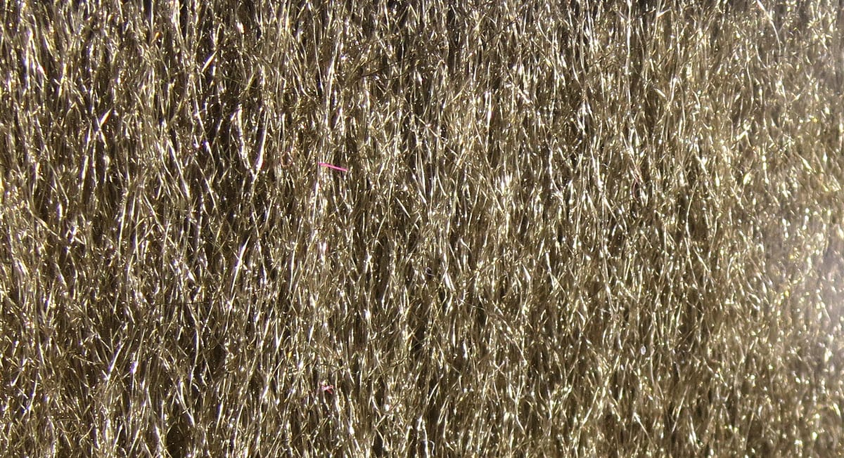 Hareline Ice Fur fly tying material: olive-gold synthetic fur with long iridescent sparkle fibers
