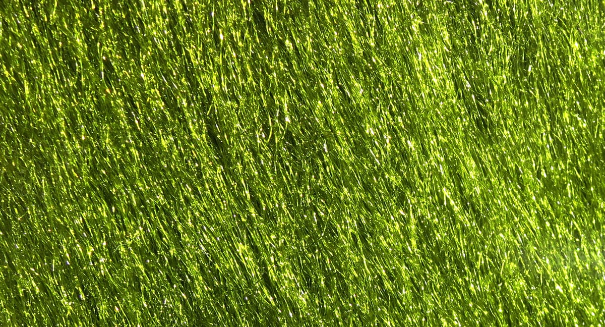 Hareline Ice Fur chartreuse synthetic fur for fly tying, long iridescent fibers with glittery, reflective sheen