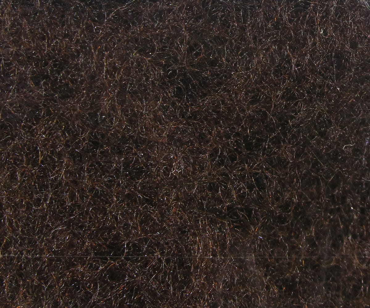 Dark brown micro dry fly dubbing fibers with subtle iridescent sparkle for fly tying