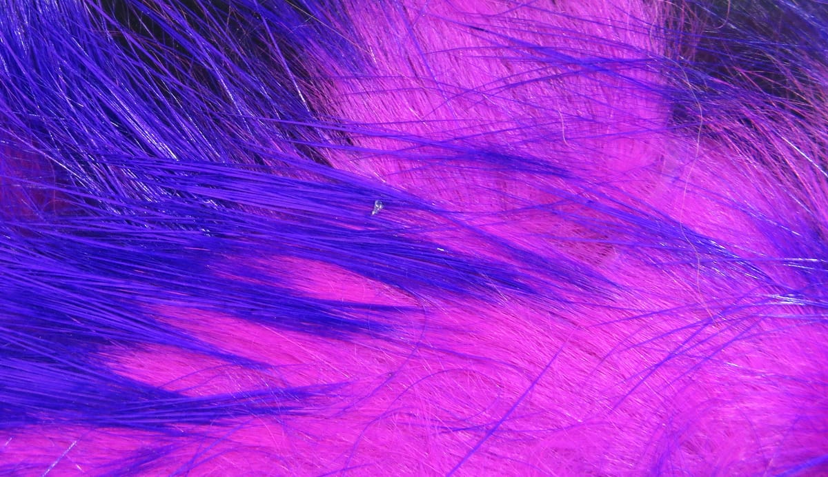 Hareline Micro Pulsator strips neon purple and hot pink synthetic fur with long shimmering micro fibers for fly tying