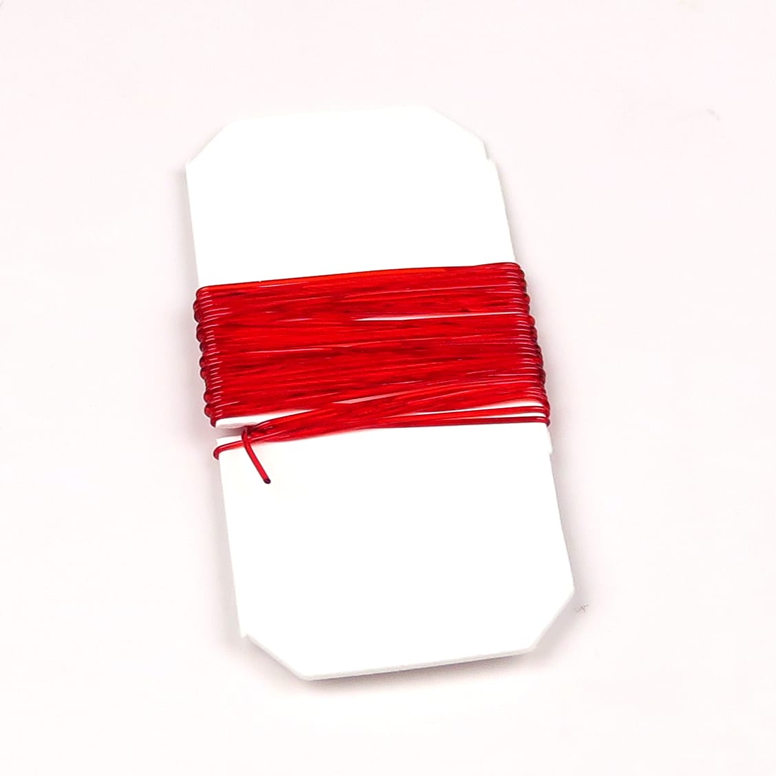 Hareline Midge Stretch Rib bright red elastic rib wrapped on white card for fly tying