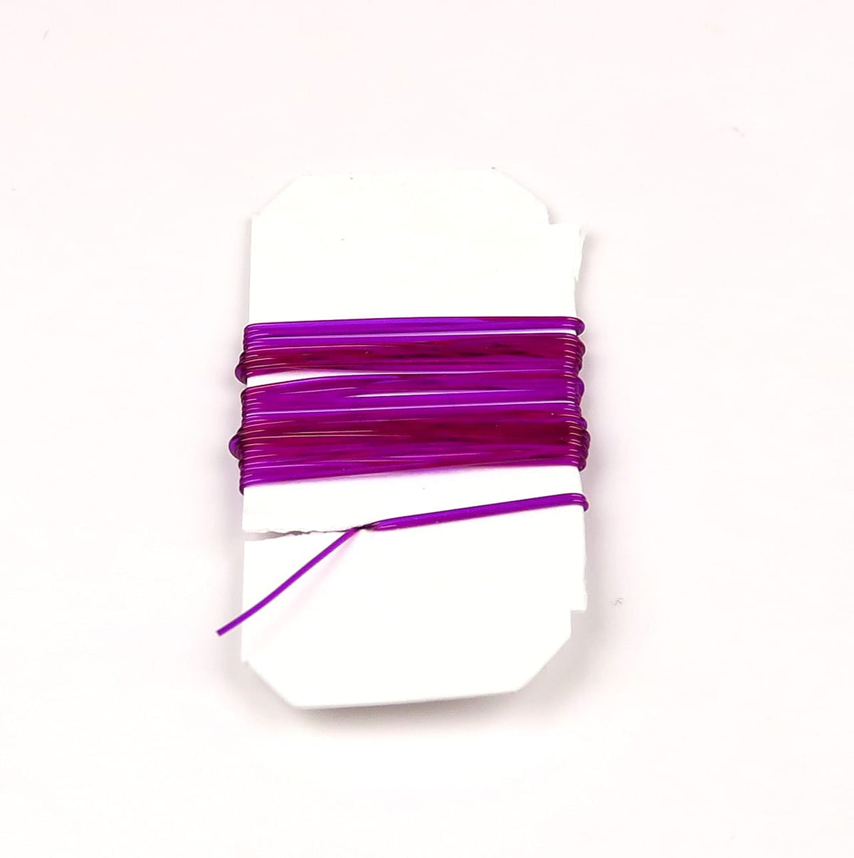 Purple magenta stretch rib glossy elastic synthetic wire wrapped on white card for fly tying