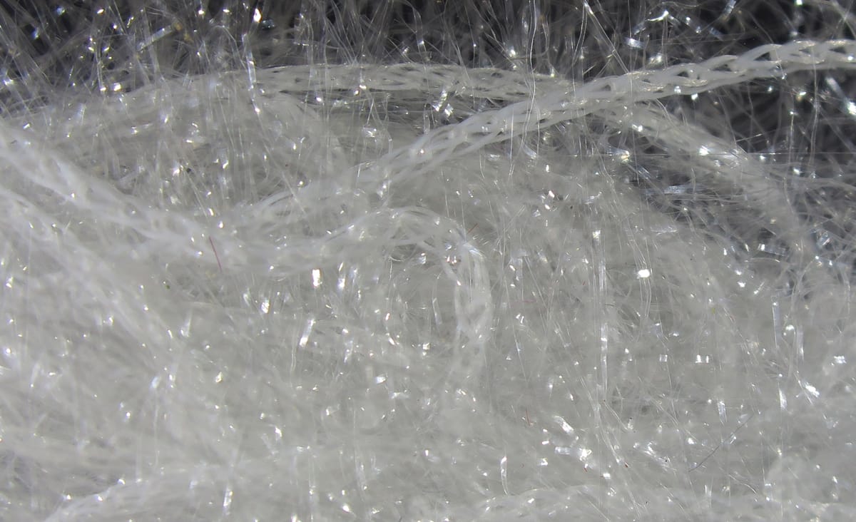 White Hareline Polar Chenille with fine fibrous strands and iridescent tinsel sparkle, fly tying material