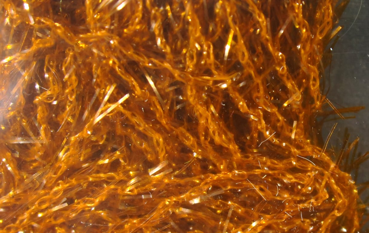 Hareline Polar Chenille metallic copper-orange with sparkling tinsel strands, textured fly tying material