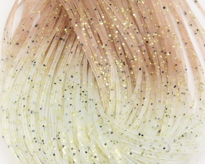 Hareline Shrimpy Crabby Legs fly tying material: translucent cream-to-tan rubber strands with gold and black glitter flecks.