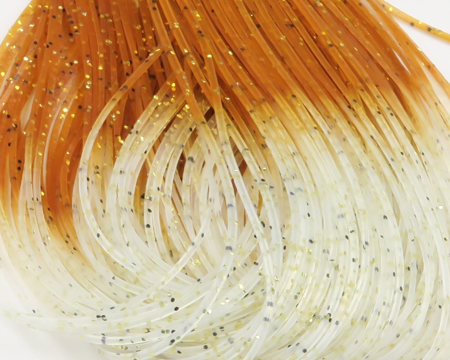 Amber-to-ivory translucent rubber crabby legs with gold and black glitter flakes, fly tying material
