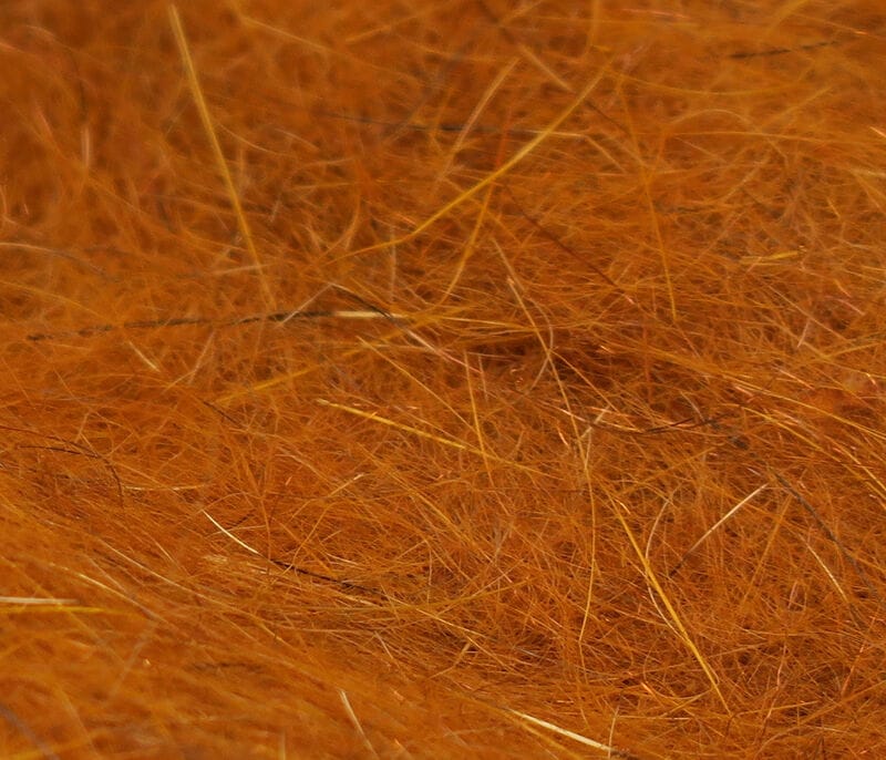 Hareline squirrel hair dubbing in orange-brown, close-up of fine guard hairs and fluffy underfur for fly tying