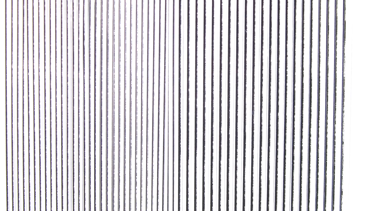 Hareline synthetic quill body wrap narrow vertical black-on-white striped synthetic strips, glossy for fly tying