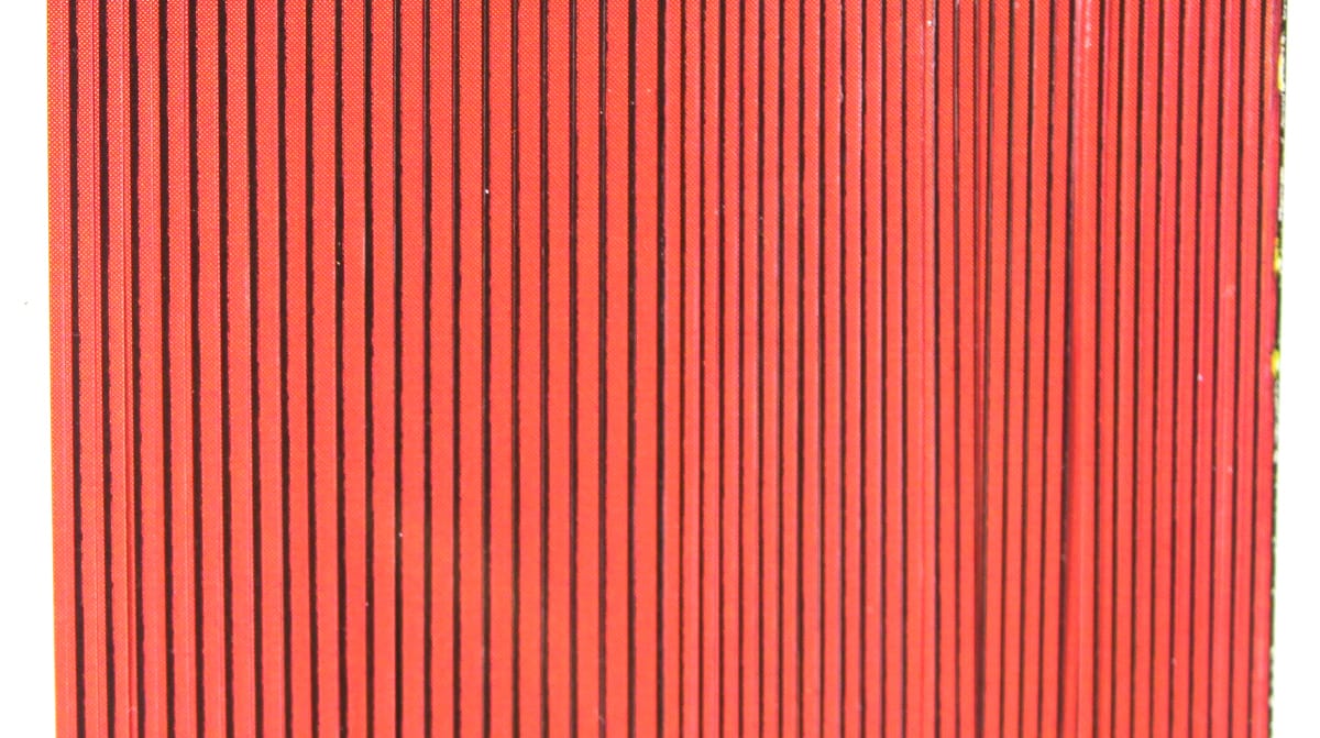 Red synthetic quill body wrap with thin black vertical stripes for fly tying