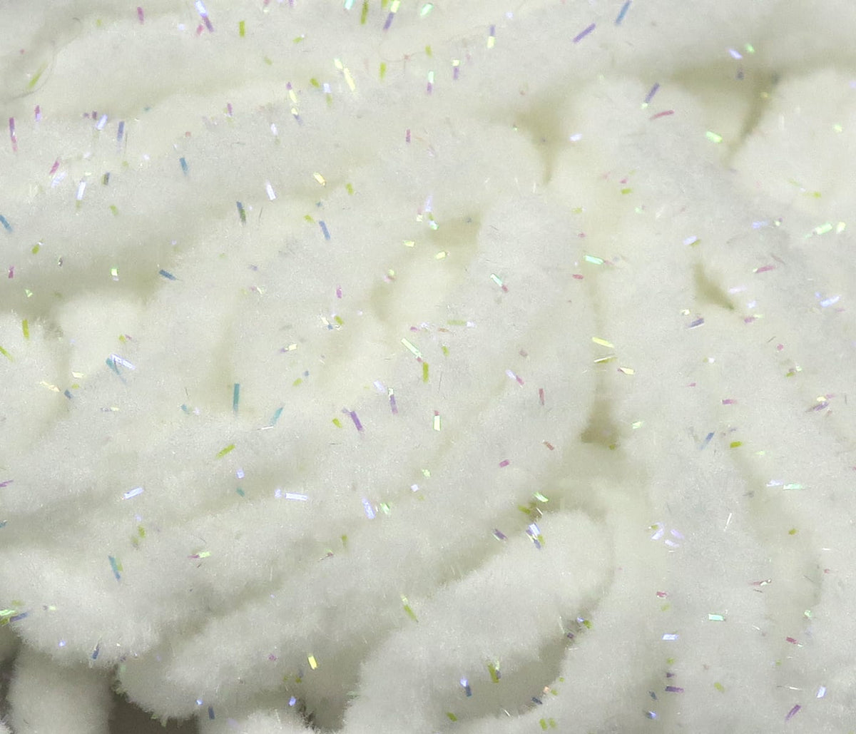 White Hareline UV Galaxy mop chenille with fluffy cotton-like strands and iridescent tinsel flakes for fly tying
