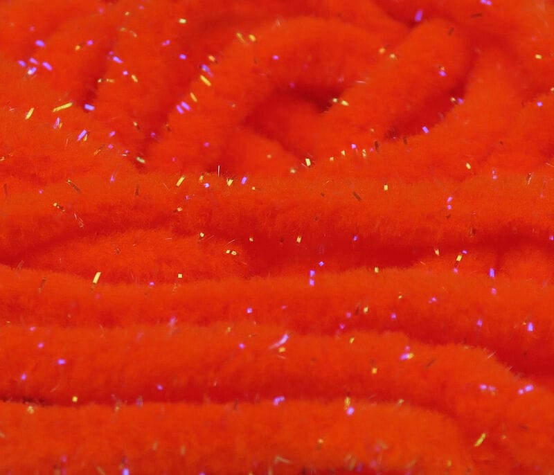 Bright UV orange Hareline Galaxy mop chenille with fluffy texture and blue-violet iridescent tinsel strands for fly tying