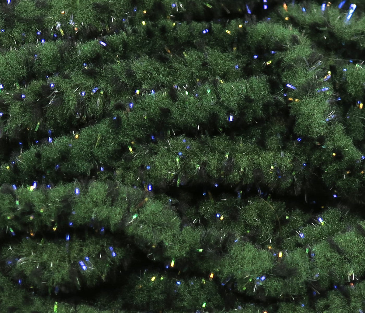 Dark olive green mop chenille with dense fuzzy texture and blue-green iridescent UV sparkle for fly tying