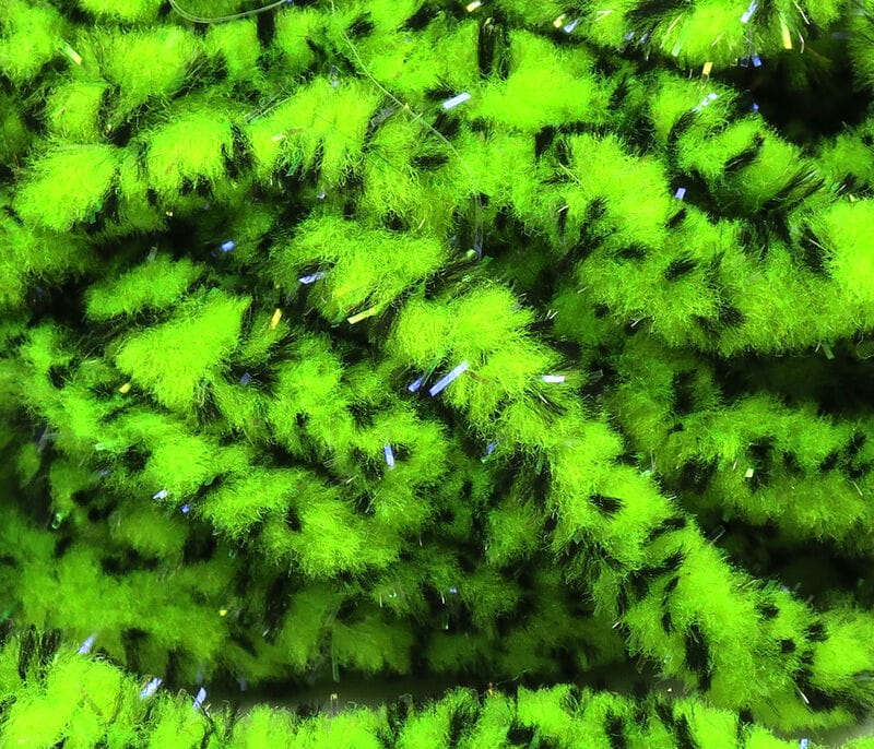 UV mottled galaxy mop chenille in bright chartreuse with black flecks and iridescent tinsel strands for fly tying