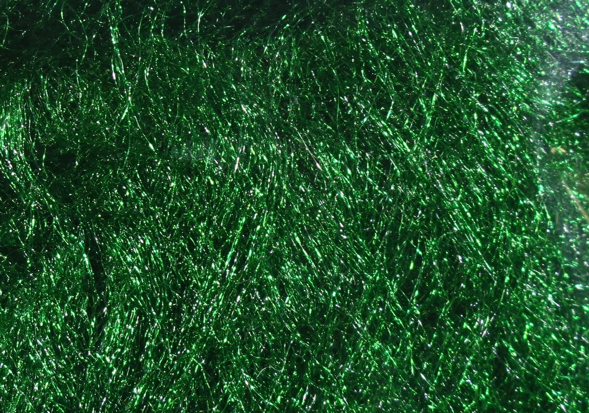 Shimmering emerald green synthetic laser hair dubbing fibers with fine metallic sparkle for fly tying.