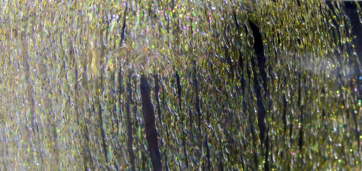 Iridescent olive-green Hedron Flashabou weave, braided holographic tinsel strands for fly tying