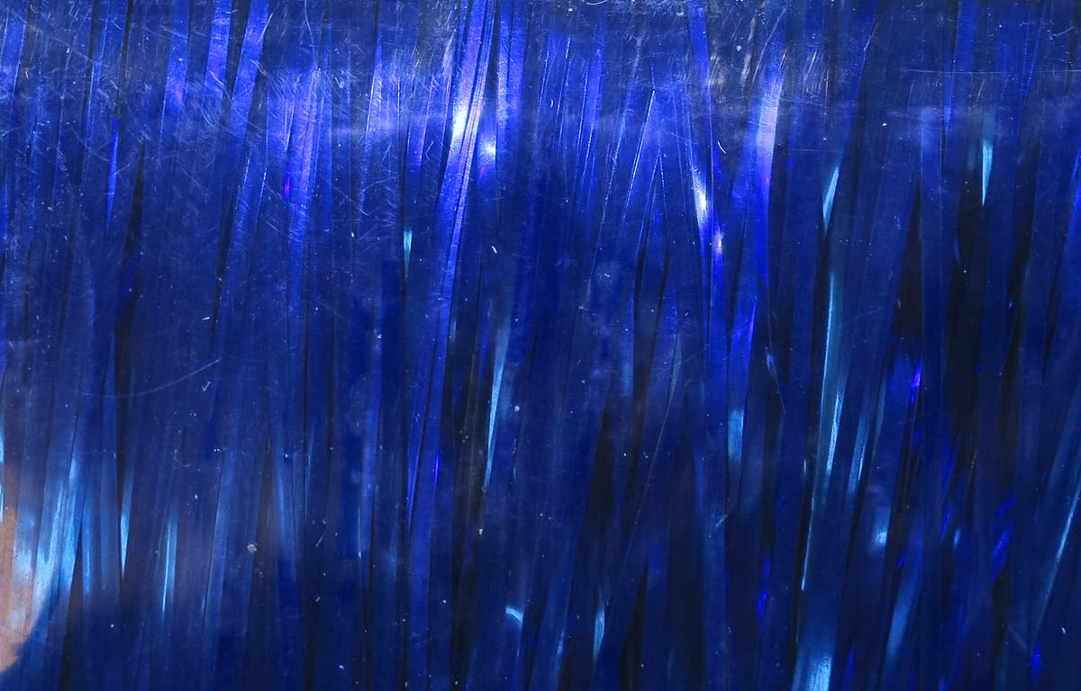 Deep metallic blue Hedron Magnum Flashabou strands, glossy reflective strips for fly tying