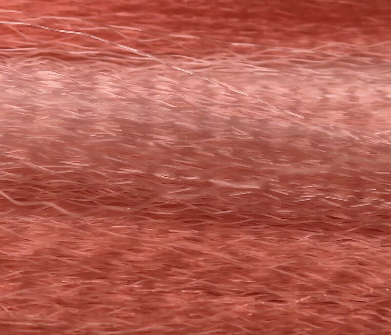 Hedron Unique Hair peach-coral synthetic fibers for fly tying, fine shimmering strands