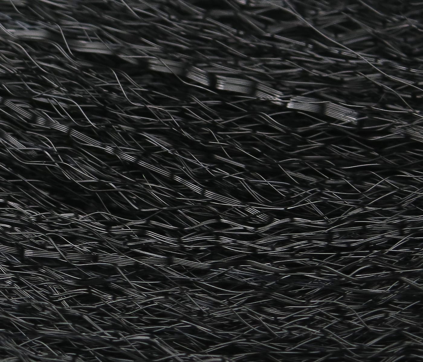 Black Hedron Unique Hair: glossy fine synthetic fibers with crinkled layered strands for fly tying