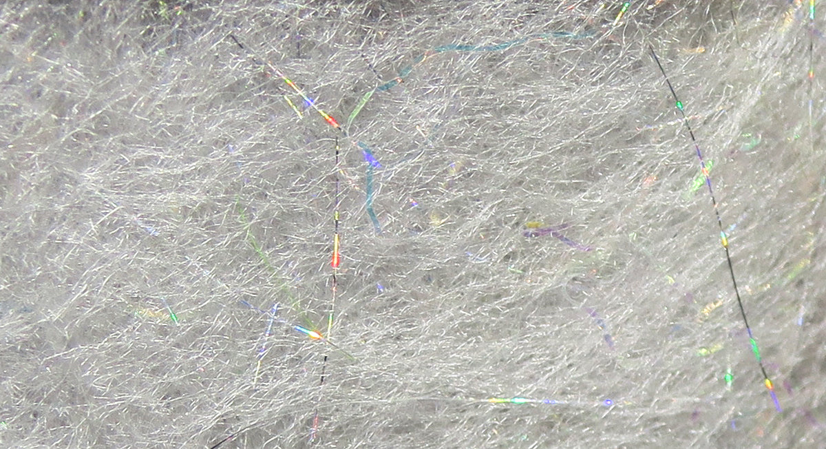 Light gray Jr. Bruiser dubbing blend with fluffy synthetic fibers and holographic tinsel strands for fly tying