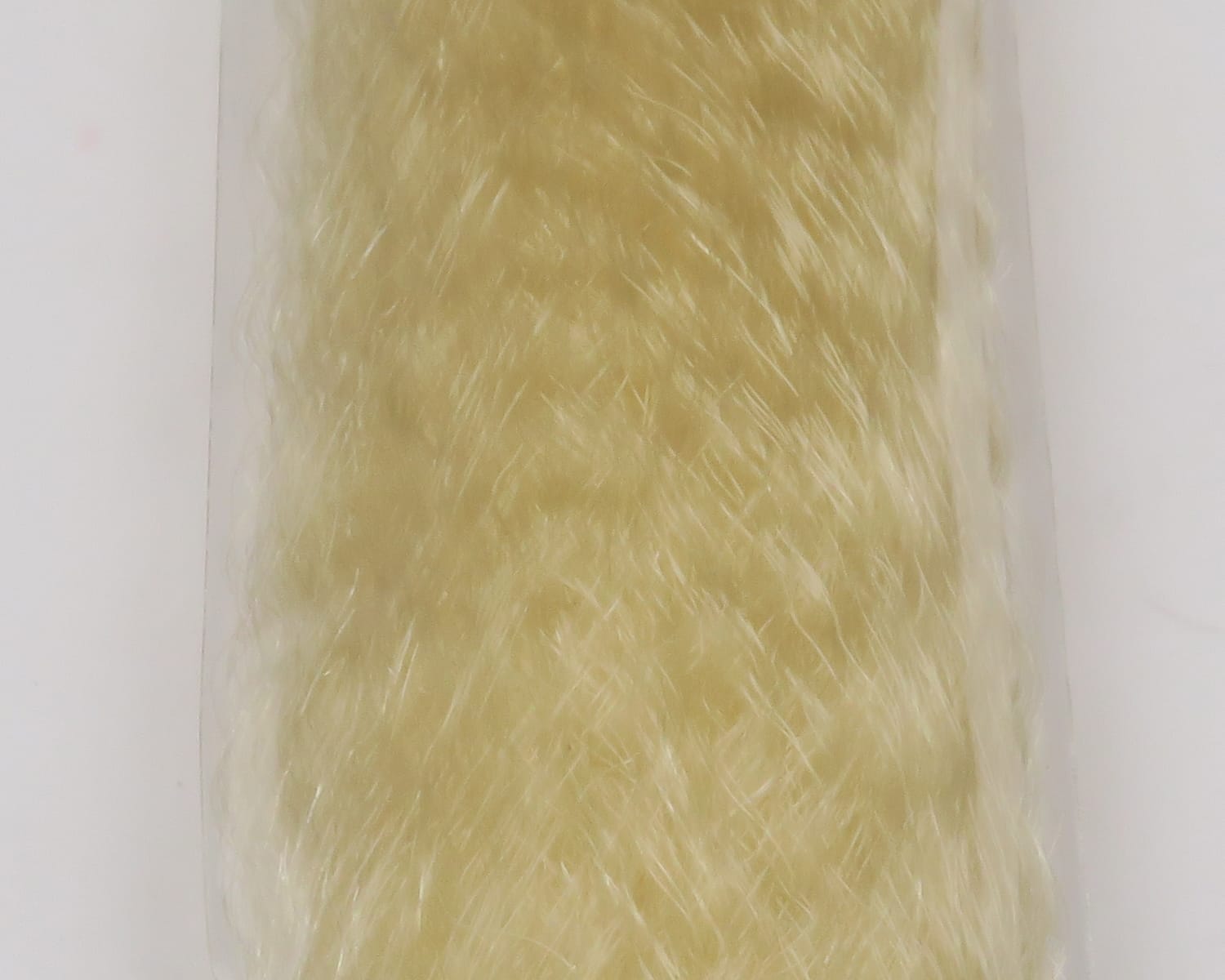 Pale cream slinky fibre with glossy long synthetic strands, soft wispy texture for fly tying