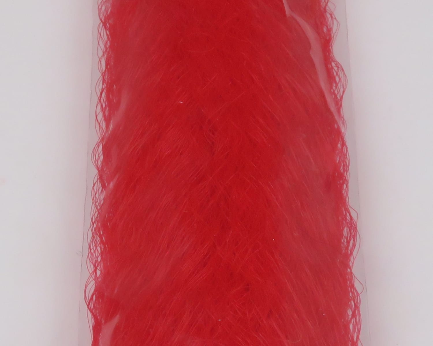 Bright red slinky synthetic fibre bundle with fine wavy strands, glossy finish for fly tying