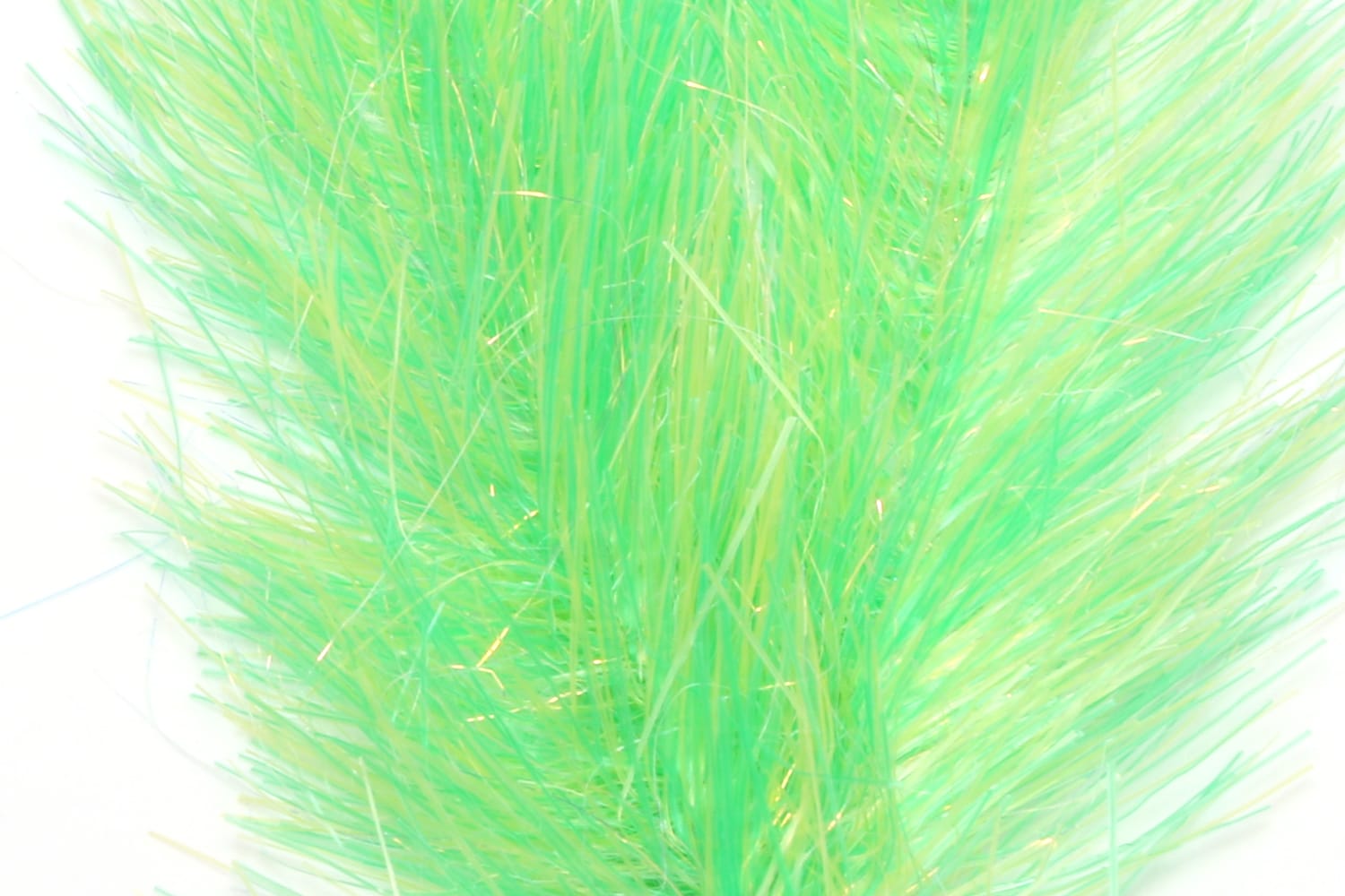 Translucent chartreuse synthetic fly brush with long wispy fibers and subtle gold tinsel for fly tying