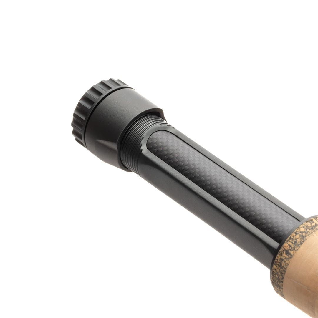 Lamson Speedster fly rod reel seat showing matte black anodized metal, carbon-fiber insert and cork handle trim