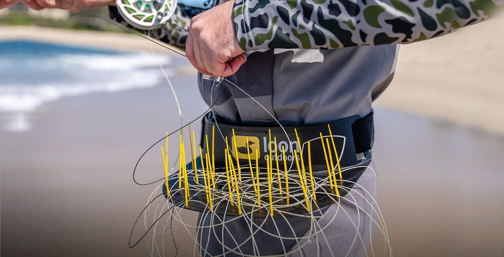 Loon Flexi Stripper waist stripping basket with black belt, curved tray and yellow flexible bristles holding fly line