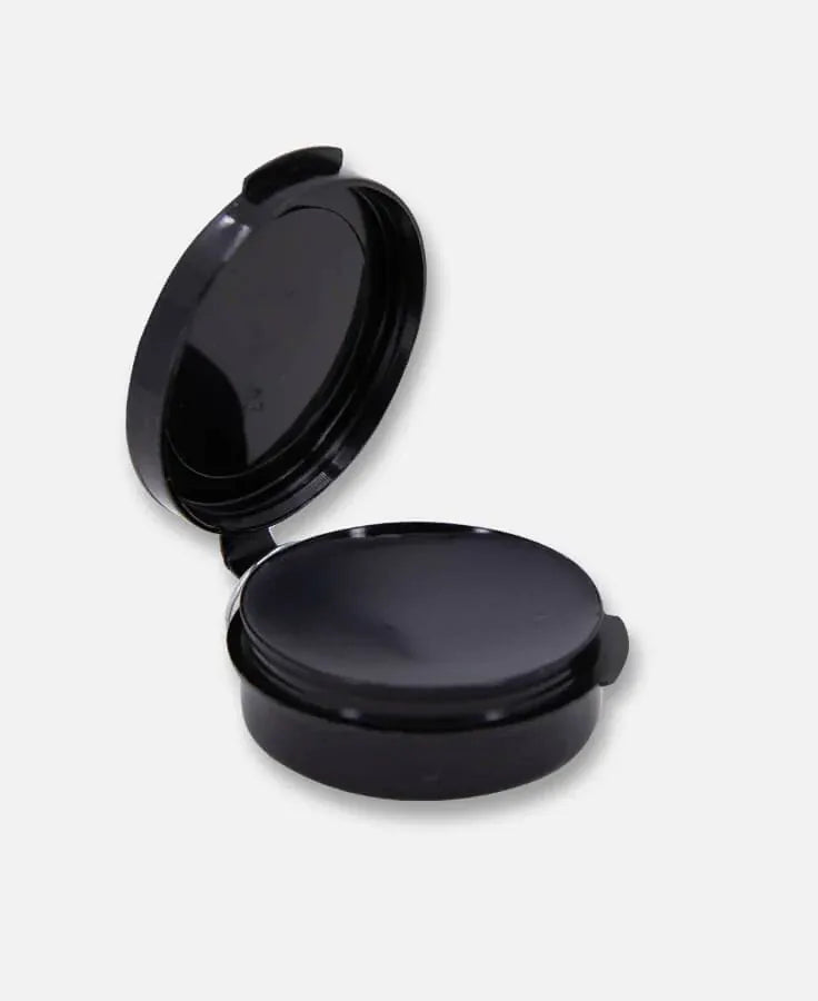 Loon ferrule wax in round black plastic flip-top tin with smooth glossy black wax disk for fly tying
