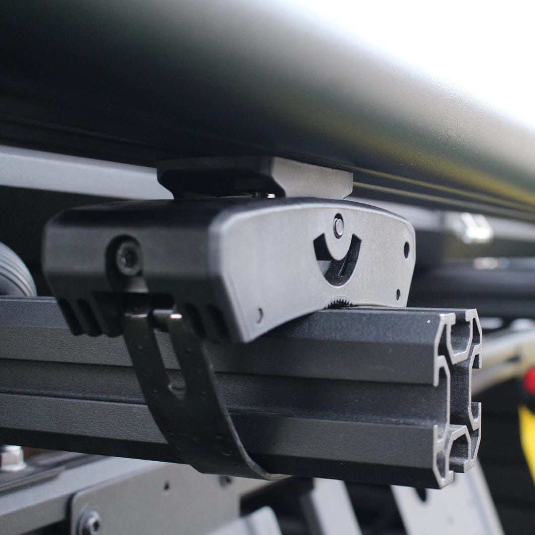Riversmith Quick Release Mount white and black rod rack accessory mounted on vehicle roof rail