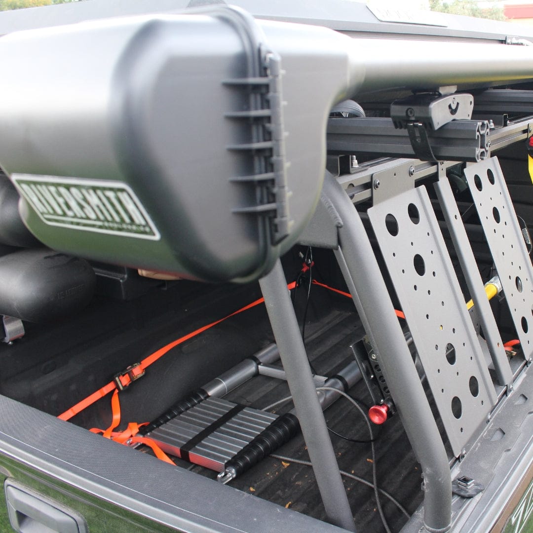 Riversmith Quick Release Mount white rod rack accessory installed on truck bed with orange straps and perforated mounting