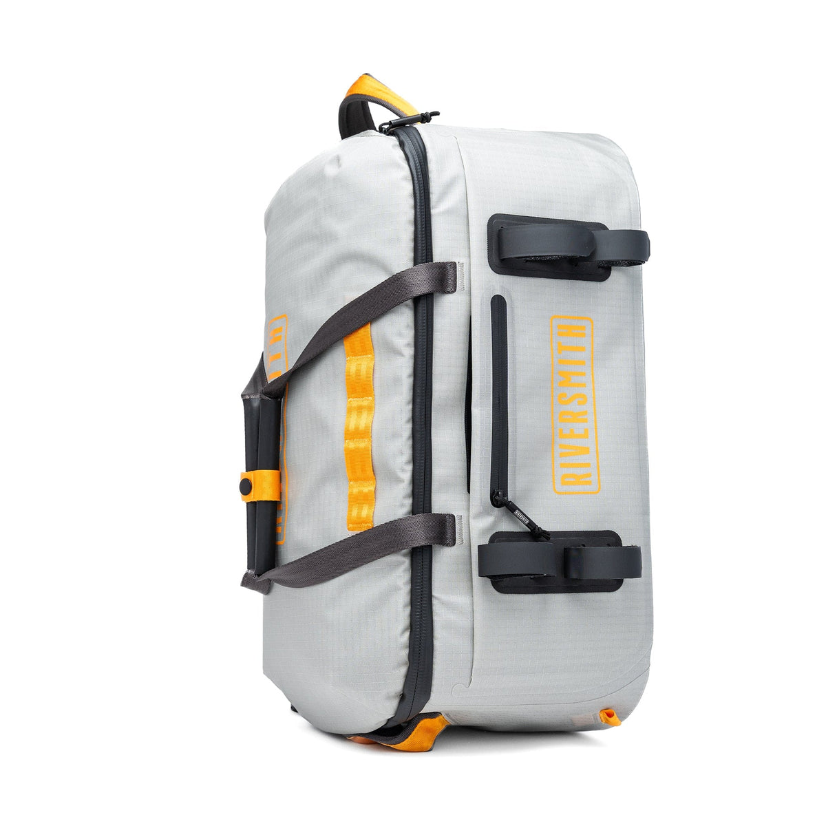 Riversmith white waterproof duffel bag with yellow accents, black straps, and carrying handles for gear transport