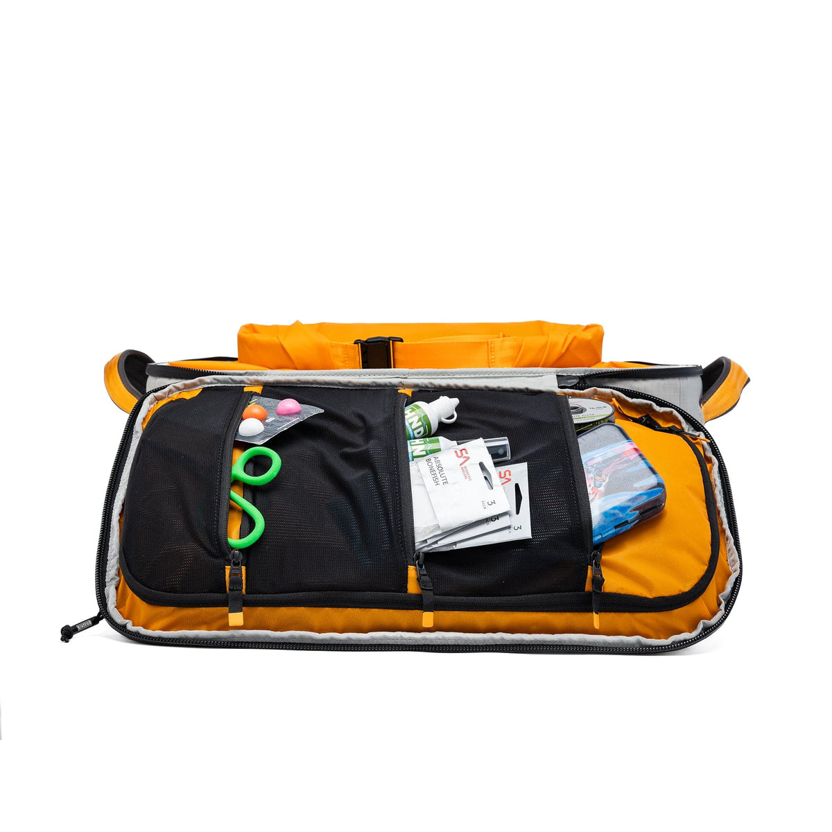 Orange and black waterproof duffel bag opened to display multiple storage compartments with fishing gear and supplies inside