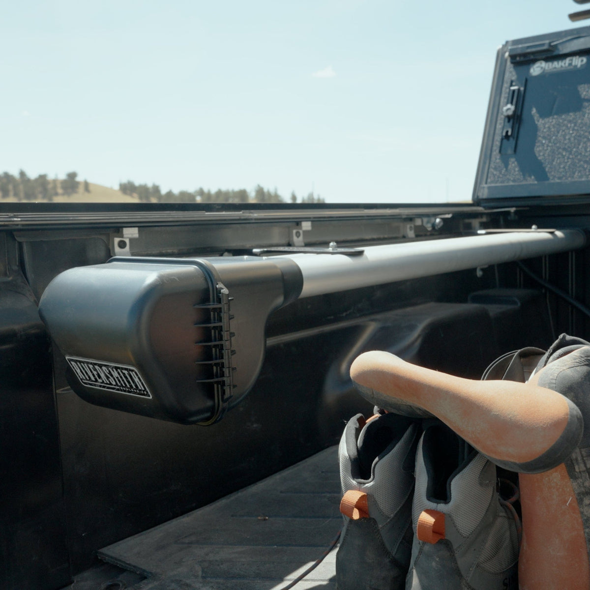 Riversmith Truck Bed Mount ShortCut RQ fishing rod rack installed on black pickup truck bed