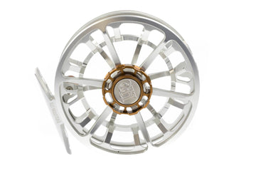 Silver machined aluminum Ross Evolution LTX large-arbor fly reel with ventilated spool and gold anodized center