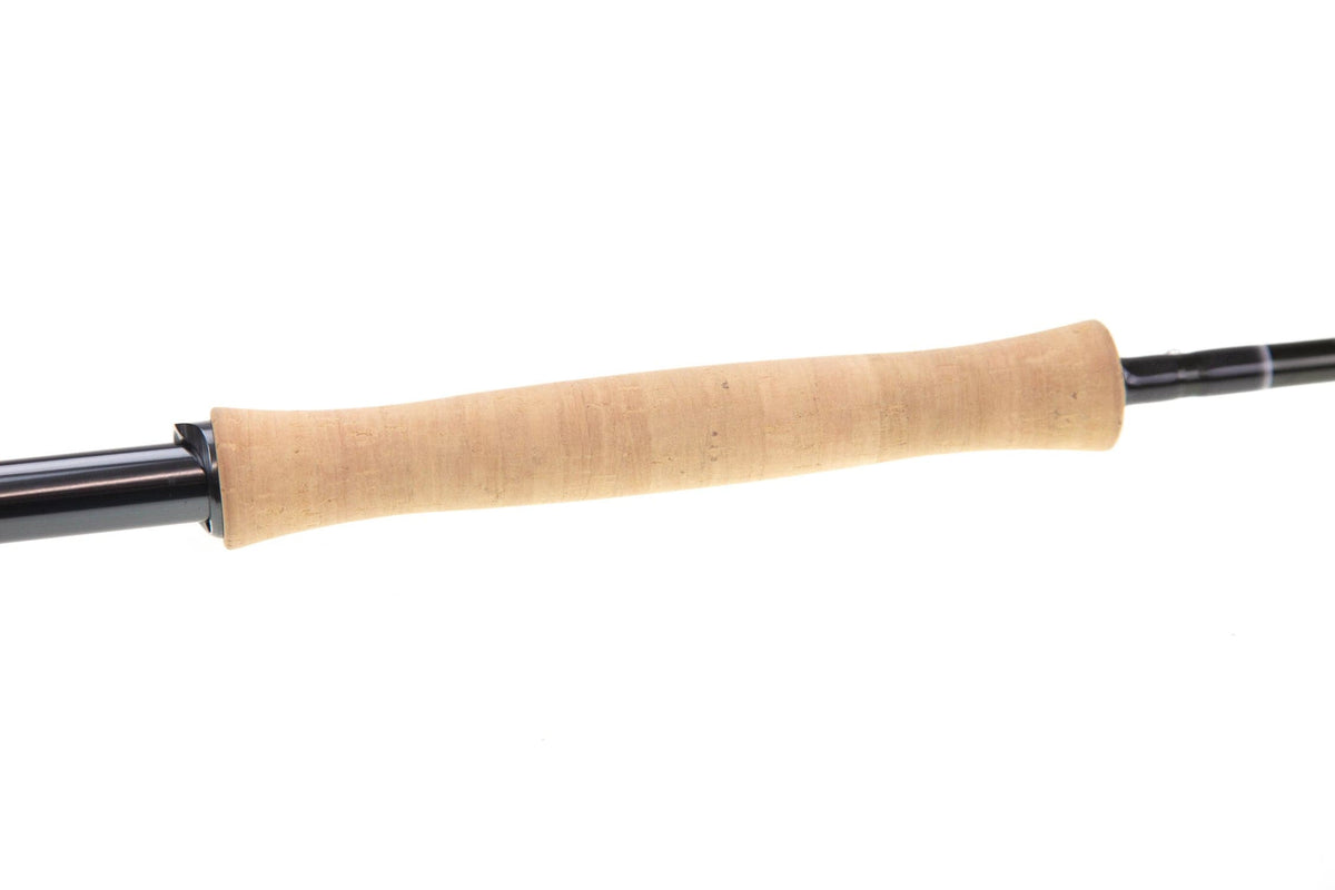 Sage R8 Core fly rod close-up showing natural cork handle and glossy black graphite blank, contoured grip