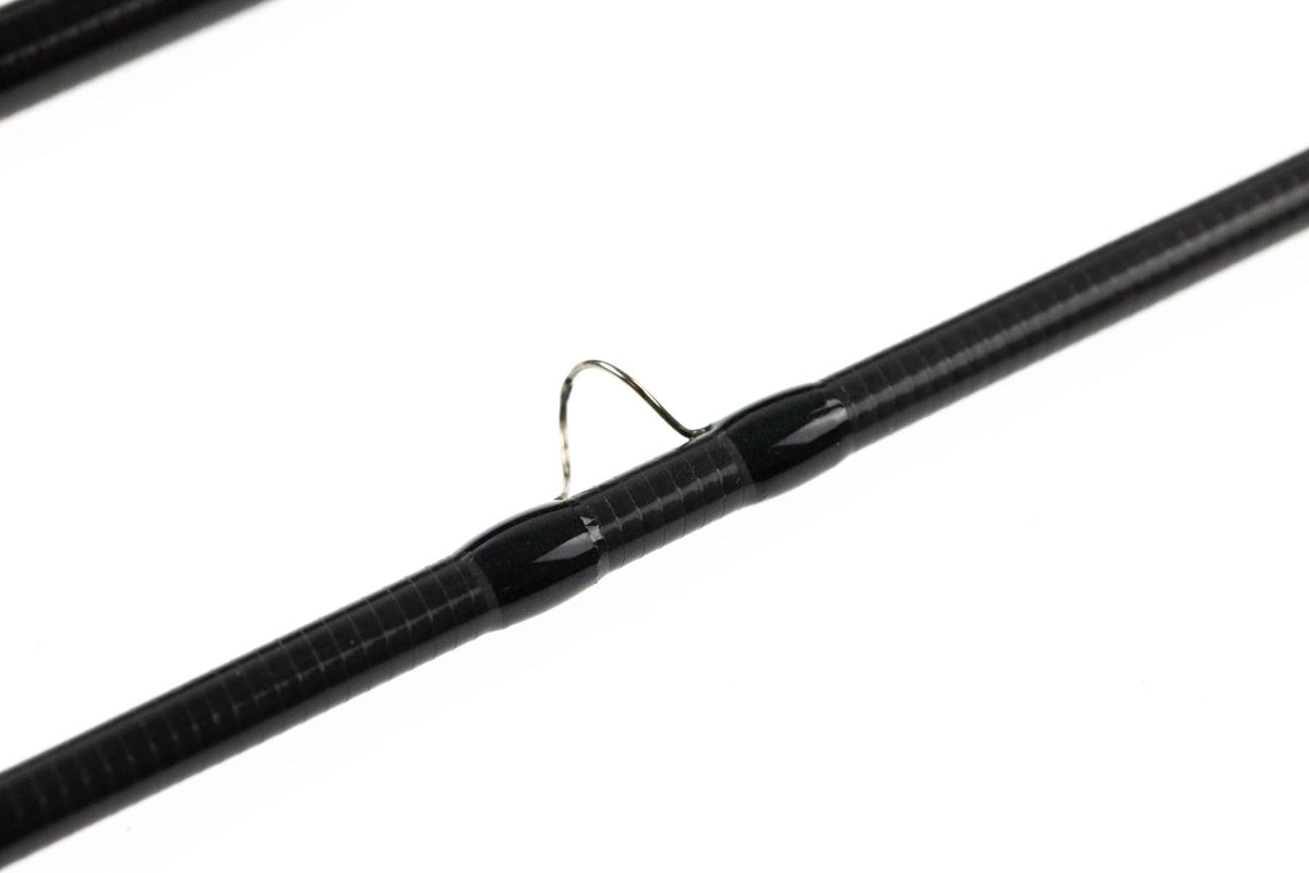 Scott Centric fly rod carbon blank with black thread wraps and silver guide ring detail