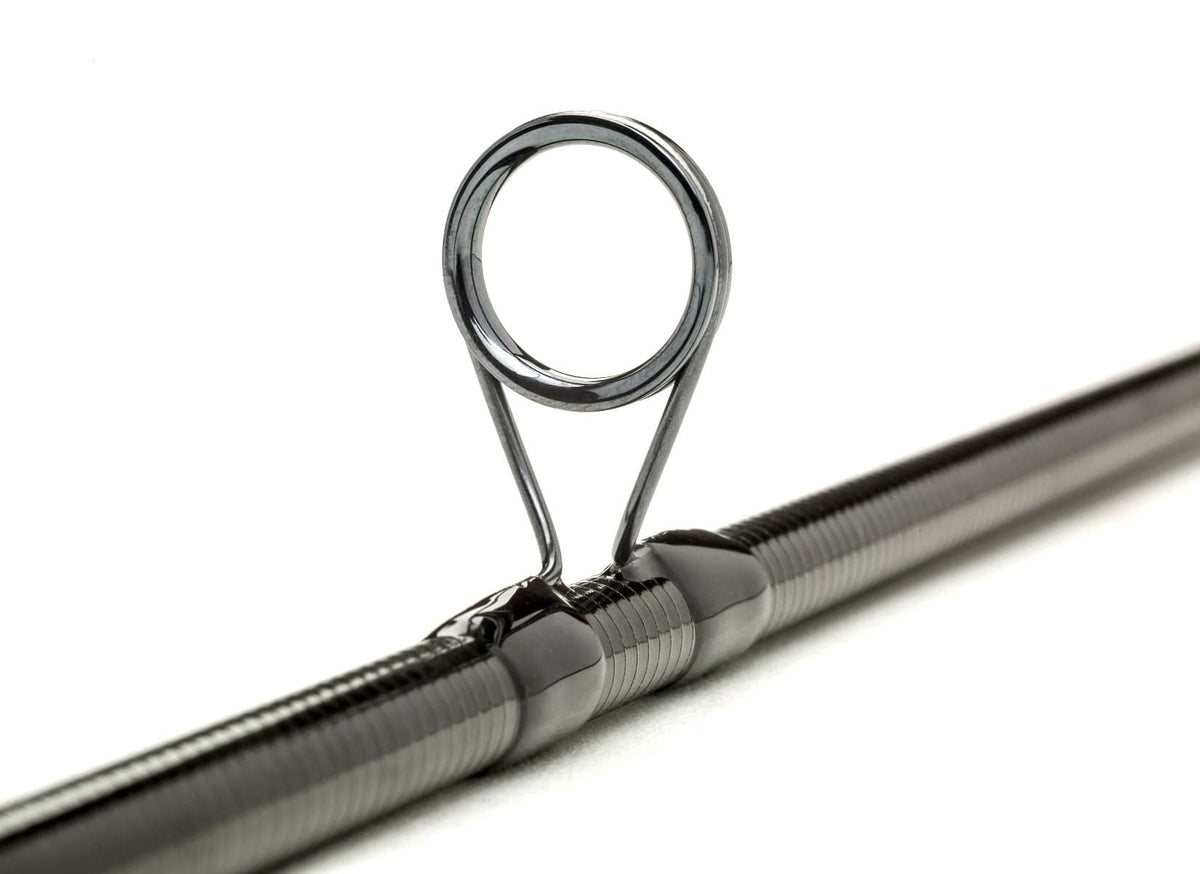 Scott Sector fly rod guide on glossy black carbon-fiber blank with polished steel ring and neat thread wraps